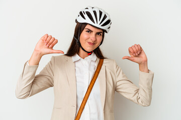 Young caucasian woman riding a bicycle to work isolated on white background feels proud and self confident, example to follow.