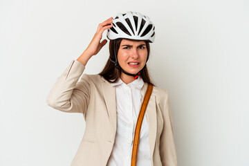 Young caucasian woman riding a bicycle to work isolated on white background being shocked, she has remembered important meeting.
