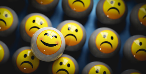 Happy smiley emoji face among sad emoticon faces