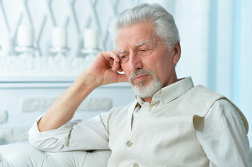 Fototapeta premium Close up portrait of thoughtful senior man