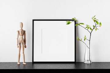 Frame mockup. Poster with plant in vase and wooden human.