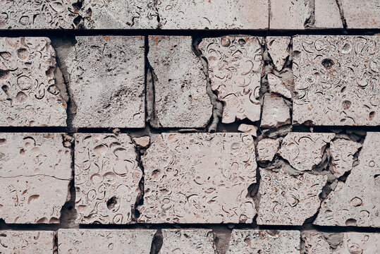 Fototapeta Old cracked brick wall with grey bricks background.