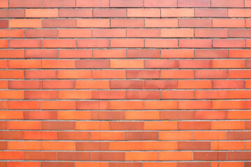 Red brown tile wall. Brick wall material for vintage, retro design and background. Interior, exterior, surface material.