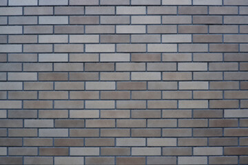 Gray brick wall. Brick wall material for vintage, retro design and background. Interior, exterior, surface material.