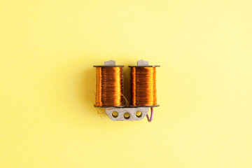 An electricity transformer on yellow background
