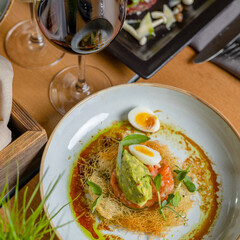 salmon tartar with egg and avocado puree