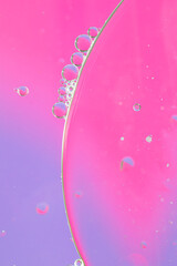 Oil drops in water. Abstract background, dominant color pink-purple. - 435213169