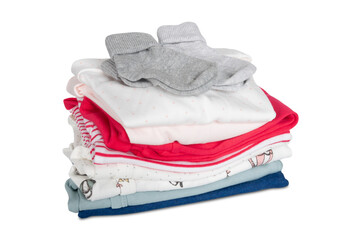 stack of newborn baby clothes isolated on white