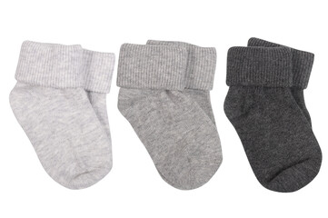 three pairs of gray socks for baby isolated on white
