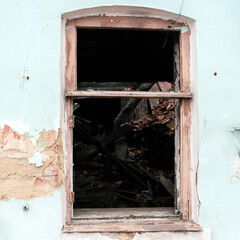 Wall with a window of an old destroyed house