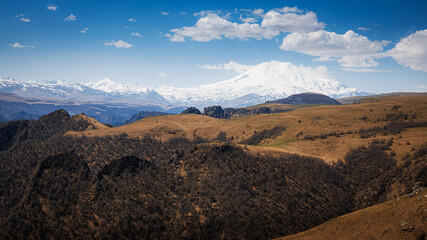 Elbrus And Green Hills with road At Sunny Summer Day. Dzhili-Su, Republic of Kabardino-Balkaria,North Caucasus, Russia.