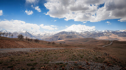Elbrus And Green Hills with road At Sunny Summer Day. Dzhili-Su, Republic of Kabardino-Balkaria,North Caucasus, Russia.