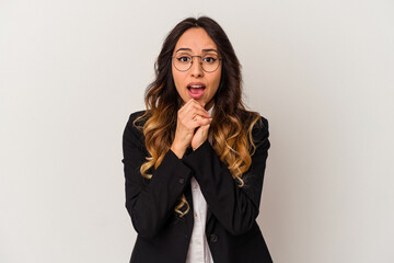 Young mexican business woman isolated on white background praying for luck, amazed and opening mouth looking to front.