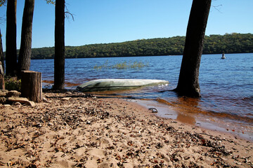 Boat on the sandy shoreline of Afton State Park and St. Croix River.