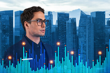 Young eastern handsome businessman in suit pondering about new approaches to consultancy to find priorities for venture capital start up to estimate prospective growth. Financial chart on Singapore.