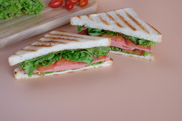 Sandwiches, a popular food that people eat together and are easy to find on the street.