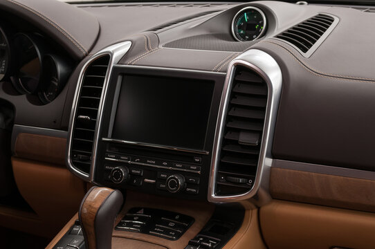 Modern car interior design. Multimedia screen and control buttons.