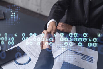Recruitment concept to hiring of a new talented specialists for international company. Handshake to sign in of employment agreement. Social media hologram icons. Women in business concept.