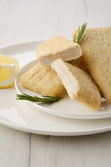 Frozen semifinished squid patty in breading