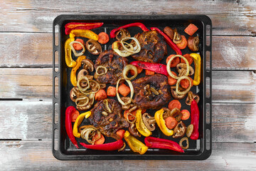 Lamb neck with champignon and vegetables baked in oven