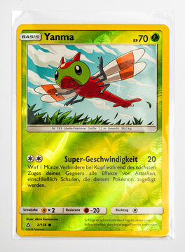Hamburg, Germany - 05232021: macro photo of the German TCG pokemon kampfstile reverse holo card Yanma in sleeve.
