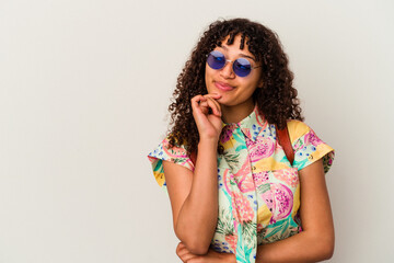 Young mixed race woman wearing sunglasses taking a vacation isolated looking sideways with doubtful and skeptical expression.