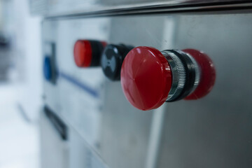 red emergency button of an industrial machine