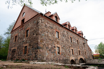 An old mill of the 19th century with a restoration in the village of Dvorishche