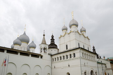 Fototapeta na wymiar Rostov Veliky, Russia - July 24, 2019: Rostov Kremlin. Domes of the Church of the Resurrection of Christ and the Assumption Cathedral. The Golden Ring of Russia