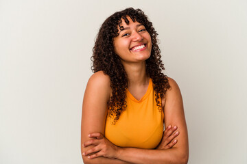 Young mixed race woman isolated on white background laughing and having fun.