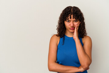 Young mixed race woman isolated on white background who feels sad and pensive, looking at copy space.