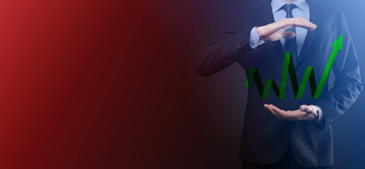 Businessman hold drawing on screen growing graph, arrow of positive growth icon.pointing at creative business chart with upward arrows.Financial, business growth concept