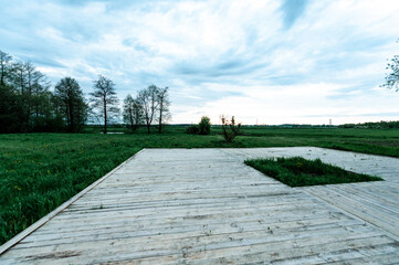 Wooden playground in the open air in the meadow