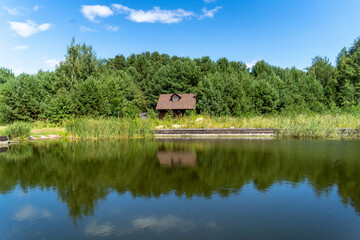 lonely house good weather in the forest near the lake