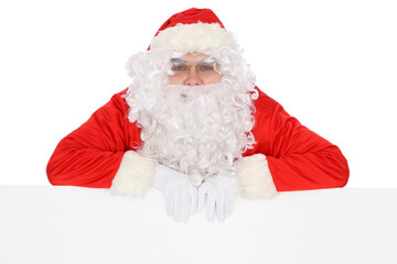 Crazy cheerful Santa Claus near copy space area, isolated over white background. Merry Christmas and New Year concept