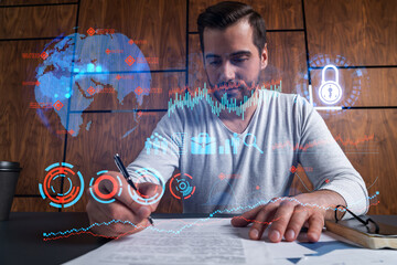 Handsome man working on fin-tech project. Multiexposure.