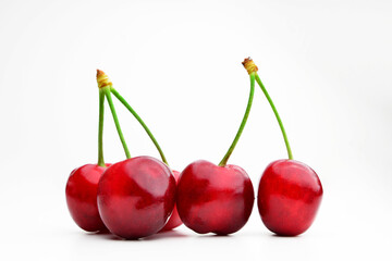 Fototapeta na wymiar Cherry isolated. Cherries on white. Cherry set. With clipping path. Cherry isolated on white background with clipping path, fresh cherries with stems and leaves, berry collection. 