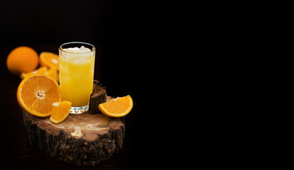 glass of orange juice and orange