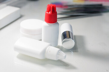 Lashmaker tools on white light background