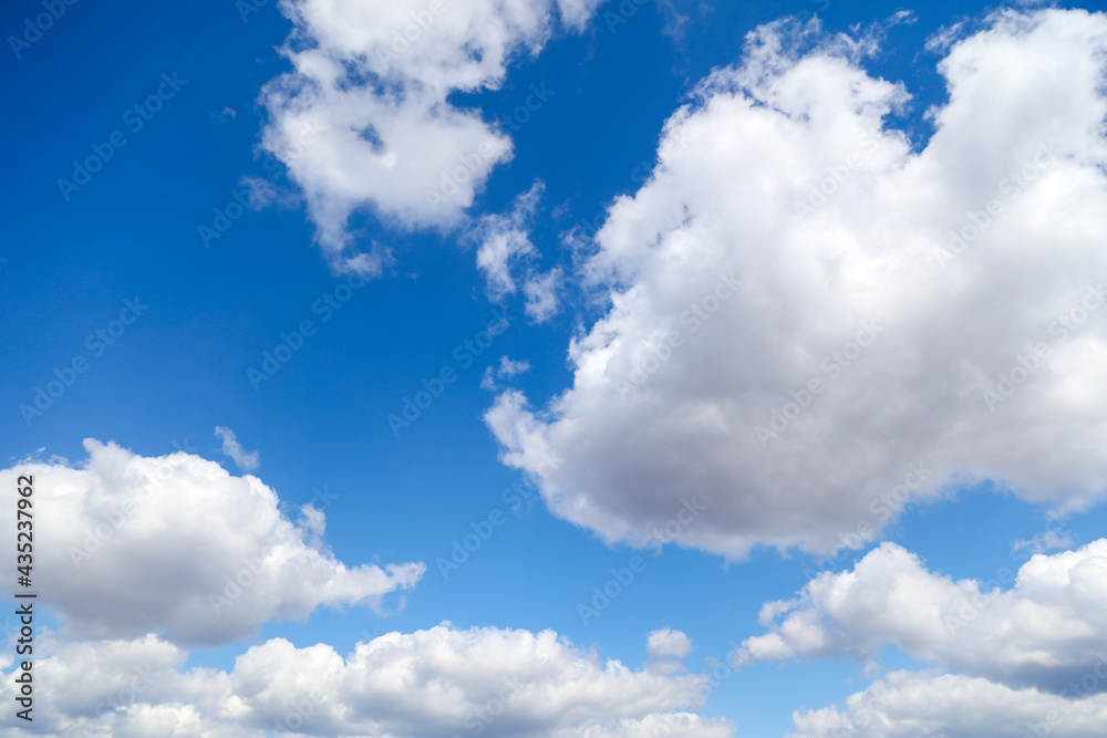 Wall mural white clouds against blue sky