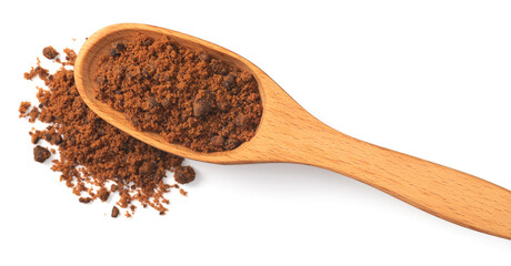 brown sugar in the wooden spoon, isolated on white background, top view