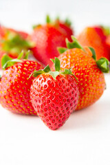 Fresh juicy strawberries fruits on white background. Fruit background.