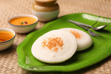 Thatte idli or Plate idly with sambar coconut chutney, chutney podi popular breakfast of Kerala...