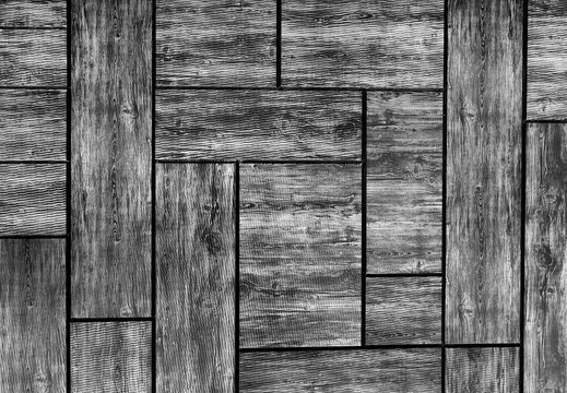 The texture of the tree. Black and white photo, texture, pattern. Wooden background. An abstraction of irregular tiles and lines.