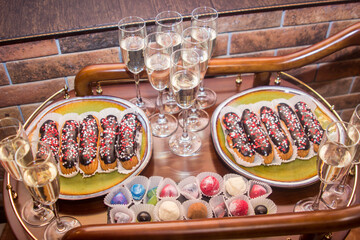 Buffet with sweet food and snacks for the guests of the event. Service at business meetings, weddings. Full table of appetizers