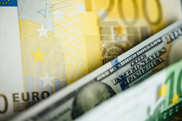 Fototapeta premium Money background. USA dollar with Euro Banknotes and Bitcoin cryptocurrency investing concept.