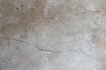 Old cracked weathered shabby plastered peeled wall banner background