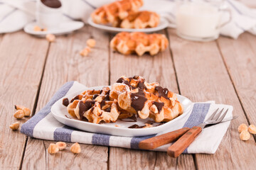 Waffles with chocolate cream and hazelnuts.