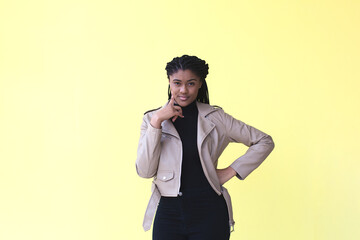 beautiful and thoughtful African American woman, on a yellow background