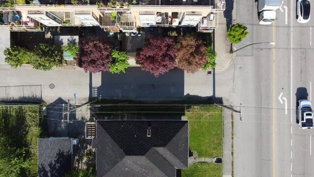 Top Down Zoom Out From Valleyway In Canada With A Busy Road Nearby